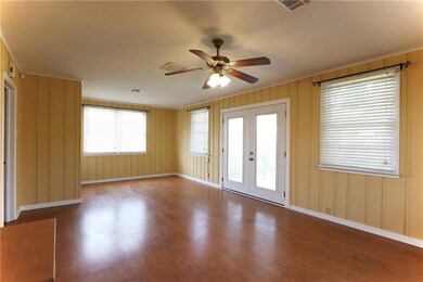 Den opens to yard & deck