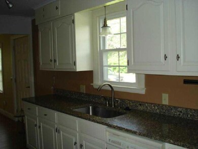 Kitchen. Galley kitchen with granite...