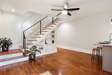 Gleaming new heart of pine wood floors downstairs,