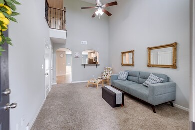 The two-story living room is open and inviting. 