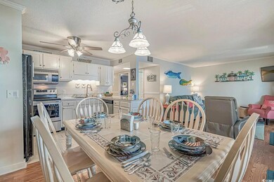 Dining room featuring ceiling fan, sink, a texture