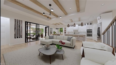 Living room featuring beam ceiling, light hardwood / wood-style floors, an inviting chandelier, and a raised ceiling