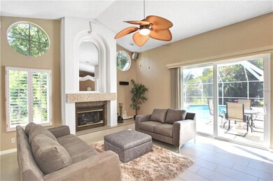 Family room with wood-burning fireplace, vaulted c