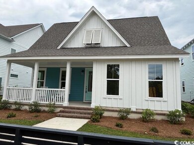 View of front of property featuring board and batt