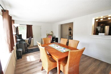 Bonus room with pass thru to kitchen, door leads o