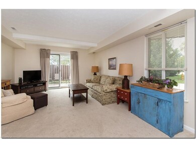 Living room has newer sliding door to patio