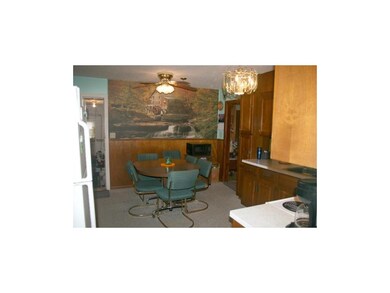 Kitchen opens to garage and living room