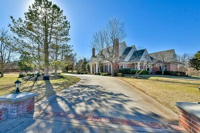 View of front of property with a front yard, concr