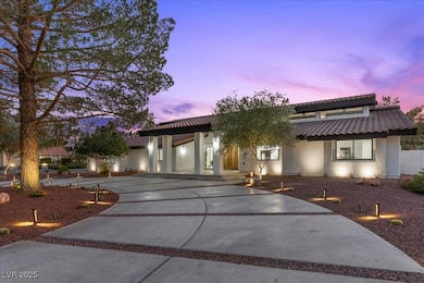 View of front facade with stucco siding, concrete