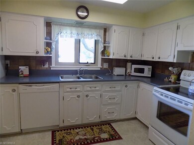 Spacious kitchen includes stove, dishwasher and re