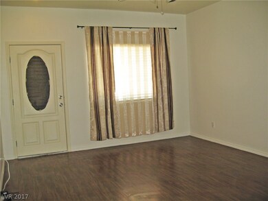 Living room with laminate floors. Home was just pa