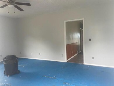 Spare room with ceiling fan and a textured ceiling