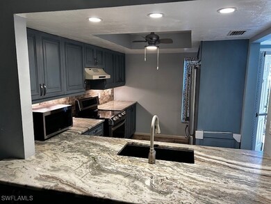 Kitchen featuring stainless steel appliances, unde