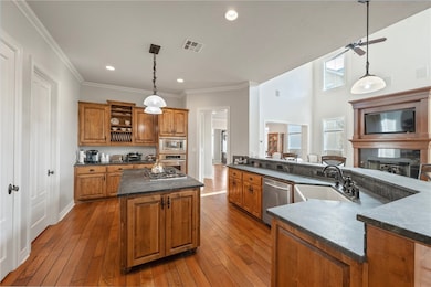 Kitchen featuring stainless steel appliances, a si