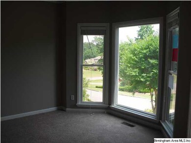 The formal dining room is off the foyer and featur