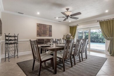 Spacious dining room has plenty of space for a lar