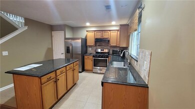 Kitchen with appliances with stainless steel finis