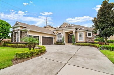 Large driveway leading to a 3 car garage.