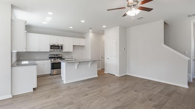 Kitchen featuring appliances with stainless steel
