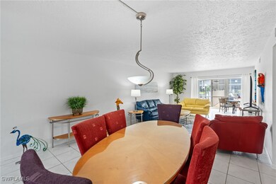 Dining room featuring tile patterned floors, baseb
