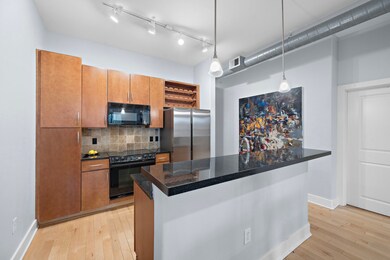 The kitchen showcases sleek modernity with stainle