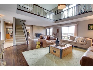 Gas fireplace and large sliders that overlook Wald