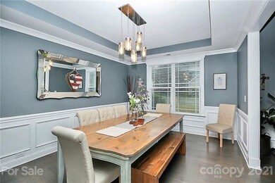 Dining room with chair rail, wainscoting, tray cei