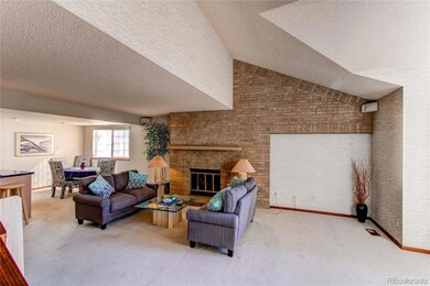 Vaulted ceiling living room with custom brick fireplace