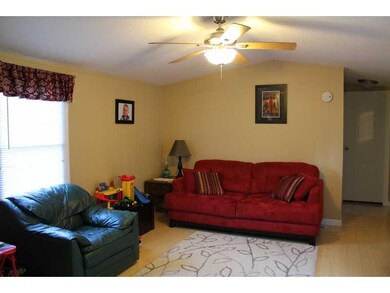 Living Room. 15 x 9 living room with paddle fan.  