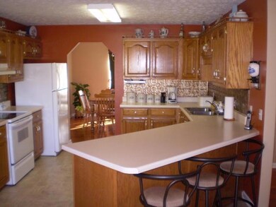 Kitchen with Lots of cabinets, new Dishwasher, bar w/seating
