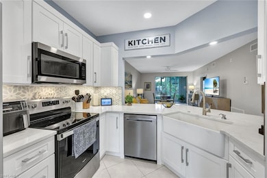 Kitchen with white cabinetry, stainless steel appl