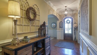 Beautiful arched front door welcomes you into the spacious foyer.