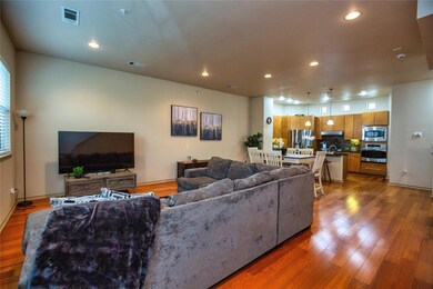 vents, wood finished floors, and recessed lighting