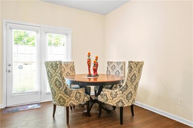 Dining area featuring wood finished floors and bas