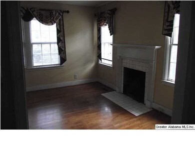Another view of the fireplace in living room with 