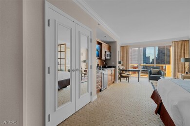 Bedroom featuring french doors, crown molding, and