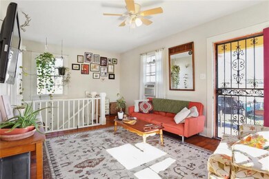 UPSTAIRS: Light-filled living room with access to