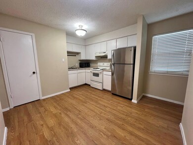 Kitchen with a sink, under cabinet range hood, wh