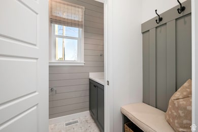 Private half bath tucked away on the main level for added convenience.