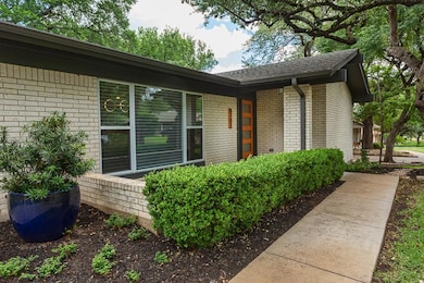 Entrance to property featuring brick siding and a