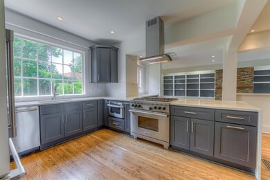 Look at the incredible Wolf gas range that comes with the house. Many new appliances include vent a hood, built in micro, and wine cooler. Fridge and washer/dryer included as well. Appliances as is and appear to all work fine.