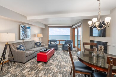 Living room featuring an inviting chandelier and a