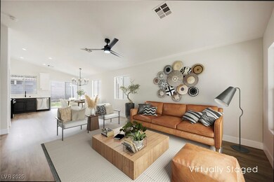 Living room with baseboards, wood finished floors,