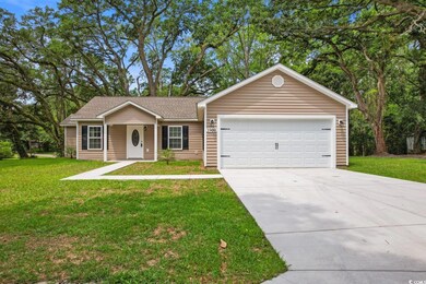 Ranch-style home with a garage and a front yard