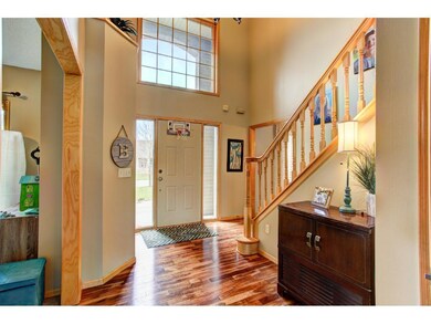 Spacious and light-filled Foyer has gleaming hardw
