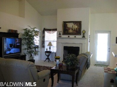 Central greatroom is open and light with fireplace