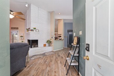 Upon entry you will notice the wood look tile thro