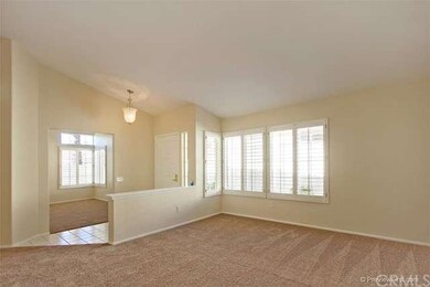 living room to den, plantation shutters throughout