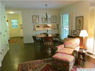 Cozy den open to eat-in-area and kitchen.