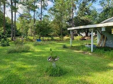 2nd carport and view of expansive backyard